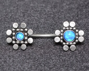 May include: A silver body piercing with two flower-shaped ends. Each flower has a blue opal gemstone in the center.