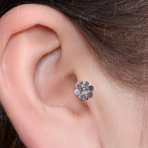 Tragus earring. Cartilage earring stud. Forward helix piercing. Conch stud. Internally threaded Labret piercing. Flat back helix earrings.