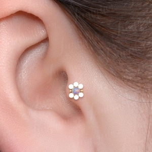 Tragus earring. Cartilage earring stud. Forward helix piercing. Conch stud. Internally threaded Labret piercing. Flat back helix earrings.