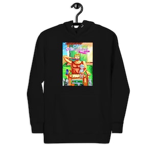 Puede incluir: Sudadera con capucha negra con una ilustración colorida de un hombre con barba y un niño sentado en una silla. La ilustración incluye una nube rosa con el texto "Cat Dad" en letras moradas.