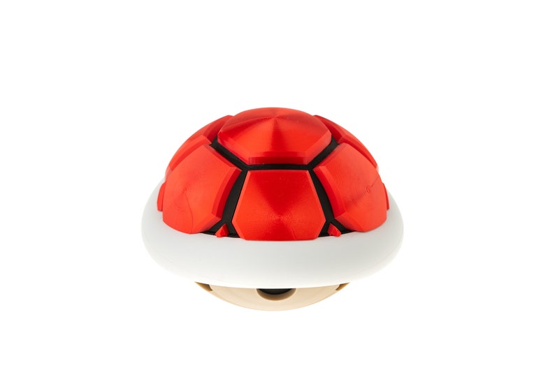 May include: A red and black shell with a white base. The shell is a popular item in video games.