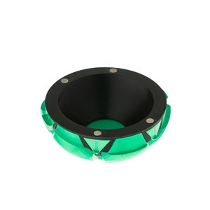 May include: A green and black bowl with a geometric design. The bowl has a black interior and a rim with four silver metal accents.