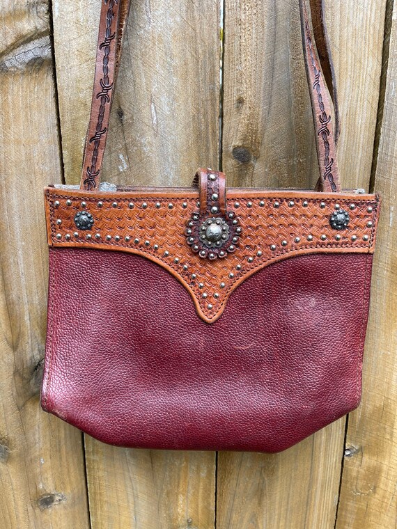 Vintage tooled leather handbag. leather including… - image 1