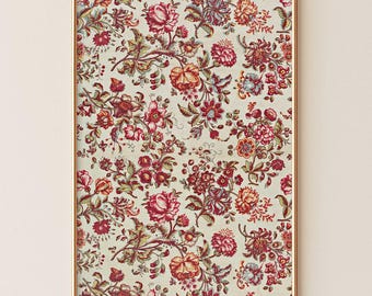 May include: A framed floral print with a repeating pattern of red, pink, and yellow flowers and green leaves on a cream background. The print is in a gold-coloured frame, creating a vintage aesthetic.