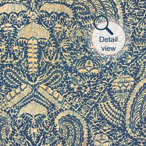 detail view of Indonesian batik textile wall art print showing abstract crayfish motif in indigo blue and cream tones