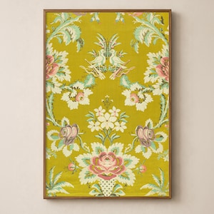 Antique French textile wall art artwork symmetrical floral pattern with bird emblem in chartreuse yellow in a sleek wood frame on a soft warm cream wall