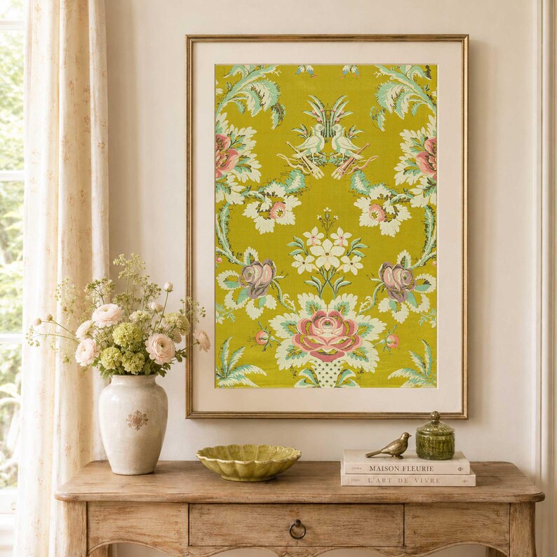 Chartreuse antique French brocade textile wall art in thin gold frame with cream mat above rustic wood console, styled with soft florals and vintage decor