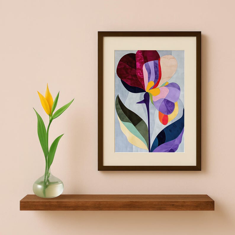 May include: A framed abstract art print featuring a colorful flower with purple, red, yellow, and green petals. The flower is on a light blue background.