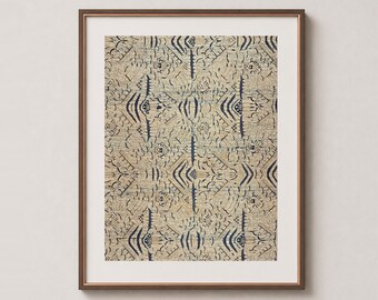 May include: A framed wall art print featuring a repeating geometric pattern in dark blue ink on a textured beige background. The design consists of symmetrical, angular lines and shapes arranged in a grid, enclosed in a thin brown frame.