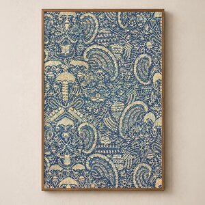 antique Indonesian Batik artwork with traditional crayfish motif in navy blue indigo and yellow cream in a sleek wood frame on a soft warm cream wall