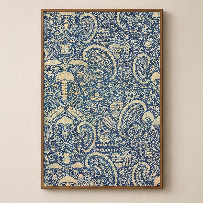 antique Indonesian Batik artwork with traditional crayfish motif in navy blue indigo and yellow cream in a sleek wood frame on a soft warm cream wall