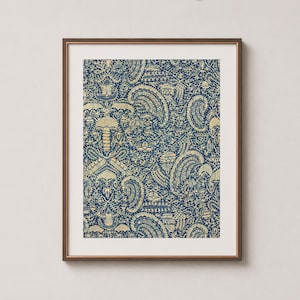 antique Indonesian Batik artwork with traditional crayfish motif in navy blue indigo and yellow cream in a sleek wood frame, with white mat, on a soft warm cream wall