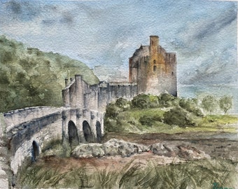May include: A watercolor painting of a stone bridge leading to a gray stone castle with a brown tower. The castle is set against a backdrop of green hills and a cloudy sky.