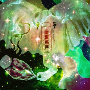 May include: An artistic digital illustration of an elephant with a cosmic design. The elephant is depicted with a trunk and large ears, with a galaxy-like pattern in shades of green, white, and purple. Stars and bright light accents are scattered throughout.