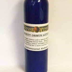 May include: A blue bottle of Infinity Ormus Lotion with a white label that reads "Infinity Ormus Lotion" and "Quintessential Alchemy".