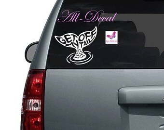 May include: White vinyl decal of a mermaid tail with the words "Get Off My Tail" on the tail fin. The decal is on the back window of a silver SUV.