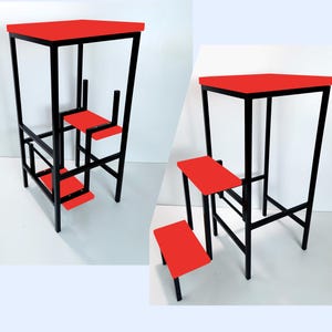 May include: A red and black metal step stool with three steps. The top step is a platform with a red surface. The stool is made of sturdy metal and has a black powder-coated finish.