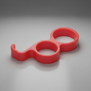 May include: A bright red, plastic, multi-functional tool. The tool has two circular finger holes and a curved hook. The design is a single piece of molded plastic. The tool is designed to help open doors and push buttons.