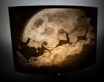 Santa Claus Boarded A Deer Sled Scenery Moon Night Light