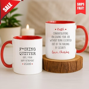 May include: Two white ceramic mugs with red interiors and handles. The left mug features black text reading F*CKING QUITTER OOPS, I MEAN HAPPY RETIREMENT 2026 with red hearts. The right mug reads Kath CONGRATULATIONS ON LEAVING YOUR JOB WITHOUT BEING ESCORTED OUT OF THE BUILDING BY SECURITY. Love, Cheska.