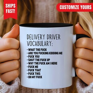 May include: A white ceramic mug with a black interior and handle, featuring the black printed text 'DELIVERY DRIVER VOCABULARY:' followed by a list of nine phrases including 'WHAT THE FUCK', 'ARE YOU FUCKING KIDDING ME', 'FUCK YOU', 'SHUT THE FUCK UP', 'WHY THE FUCK AM I HERE', 'FUCK ME', 'FUCK THAT', 'FUCK THIS', and 'OH MY FUCK'.