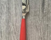 FIESTA. Shamrock Pattern. Stainless. Red Plastic Handle. Dinner Knife.