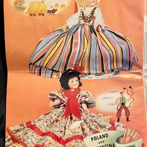 May include: Two dolls dressed in traditional Polish and Argentinian clothing. The Polish doll wears a colorful striped skirt and a beaded necklace. The Argentinian doll wears a floral dress with a red sash. The text "POLAND AND ARGENTINA PATTERNS #114, #115" is printed on the page.