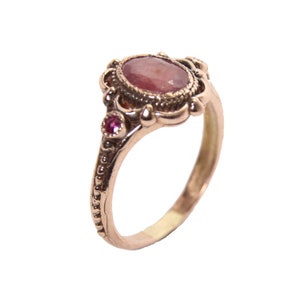 Gorgeous 14k rose gold ruby ring antique style , 1 ruby 6/8 mm + two small ruby in  the side . Handmade by me !!