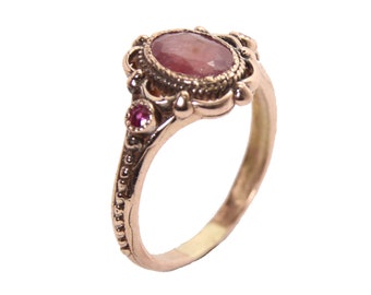 Gorgeous 14k rose gold ruby ring antique style , 1 ruby 6/8 mm + two small ruby in  the side . Handmade by me !!