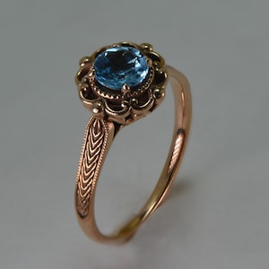 Stunning 14K rose gold antique ring with a real blue topaz