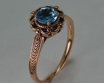 Stunning 14K rose gold antique ring with a real blue topaz