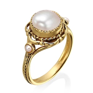 14k gold pearl ring , antique vintage style , with a gentle curly gold strings , handmade by myself .