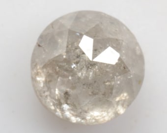 May include: A round, clear, faceted diamond with a gray hue.