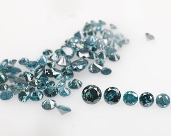 May include: A collection of loose blue diamonds, some are smaller and scattered, while others are larger and arranged in a line.
