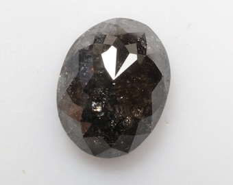 May include: A dark grey oval-shaped diamond with a faceted cut.
