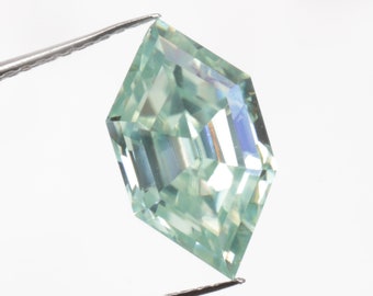 May include: A light green, hexagonal cut gemstone held by tweezers. The gemstone has a faceted design and a high level of brilliance.