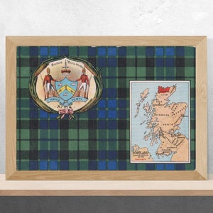 May include: A framed print of a map of Scotland with a green, blue, and black tartan background. The map shows the major cities and towns of Scotland. The print also includes a crest with the words "Manu Forti" and "Actum".