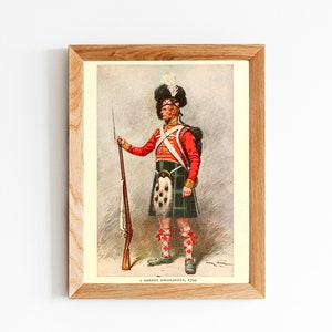 May include: A framed illustration of a soldier in a red coat and kilt, holding a musket. The soldier is wearing a feathered hat and has a white sash across his chest. The image is titled "A Gordon Highlander, 1794".