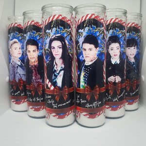 May include: Set of eight glass candle holders with red and white striped candy cane designs. Each holder features a different character from the show "The Umbrella Academy" with a quote from the show.