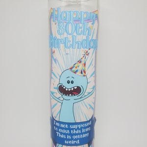 May include: A glass candle with a blue and white label featuring a cartoon character with a party hat. The label reads "Happy 30th Birthday" and "I'm not supposed to exist this long. This is getting weird."