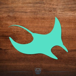 May include: A teal manta ray silhouette against a dark brown wood grain background. The stylized illustration depicts the marine animal in a dynamic pose, with its wings spread and a long tail extending to the left.