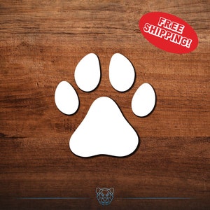 May include: White paw print decal on a brown wooden background. Free shipping is offered.