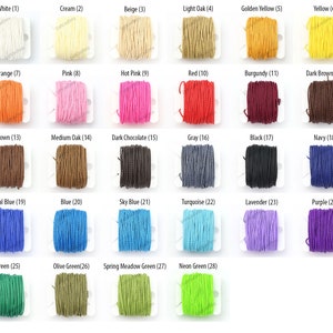 May include: A grid of 28 spools of colorful cord in various shades. Colors include white, cream, beige, light oak, golden yellow, yellow, orange, pink, hot pink, red, burgundy, dark brown, brown, medium oak, dark chocolate, gray, black, navy, royal blue, blue, sky blue, turquoise, lavender, purple, green, olive green, spring meadow green, and neon green.