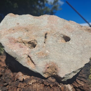 May include: A set of three ceramic vases in varying heights. The vases have a matte finish in shades of cream, beige, and brown. The tallest vase is approximately 10 inches high.