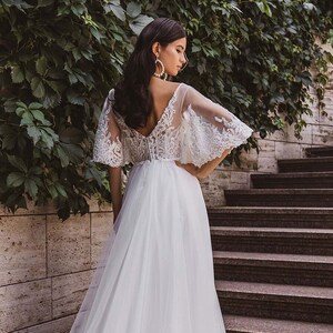 bohemian flutter sleeve wedding dress