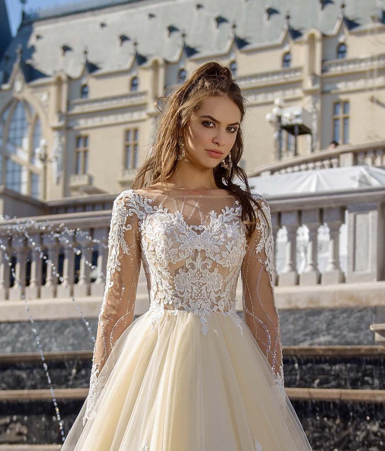 long sleeve lace blush wedding dress
