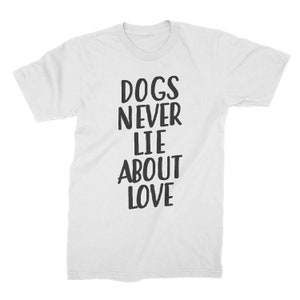 May include: White t-shirt with black text that reads "Dogs Never Lie About Love".