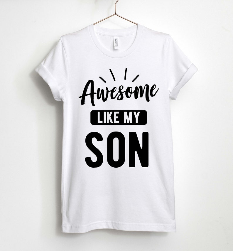 May include: White t-shirt with black text that reads "Awesome Like My Son".