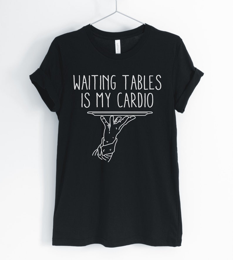 May include: Black t-shirt with white text that reads "Waiting tables is my cardio" and a graphic of a hand holding a tray.