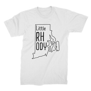 May include: White t-shirt with a black outline of the state of Rhode Island and the text "Little Rhody" inside the outline.